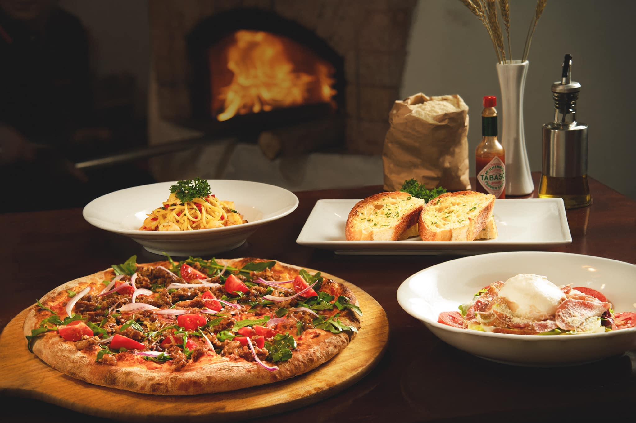 Pizza Parma Tay Ho offers a refined yet inviting Italian dining experience with a view of West Lake